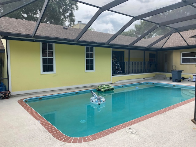 view of pool featuring a patio area and a lanai