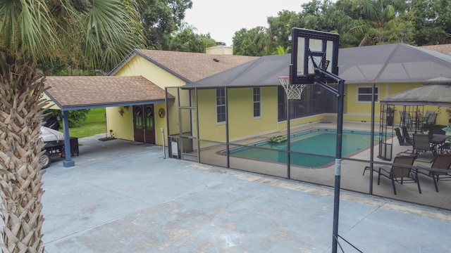 pool with french doors and a patio