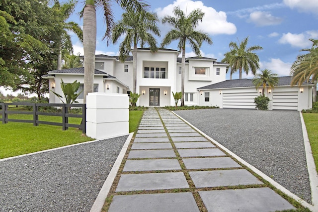 view of front facade featuring a garage and a front yard