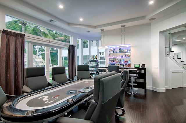 office featuring a raised ceiling and dark hardwood / wood-style flooring