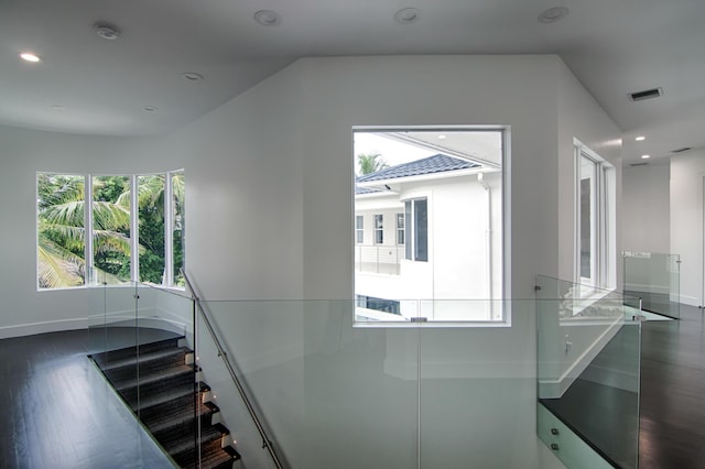 stairway featuring wood-type flooring