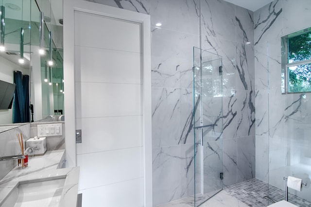 bathroom with vanity and an enclosed shower