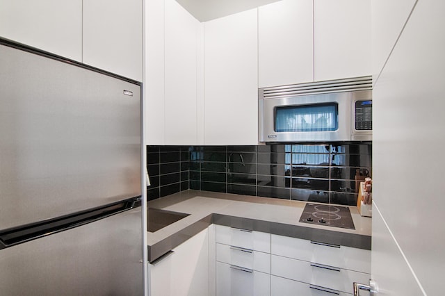 kitchen with white cabinetry and stainless steel appliances