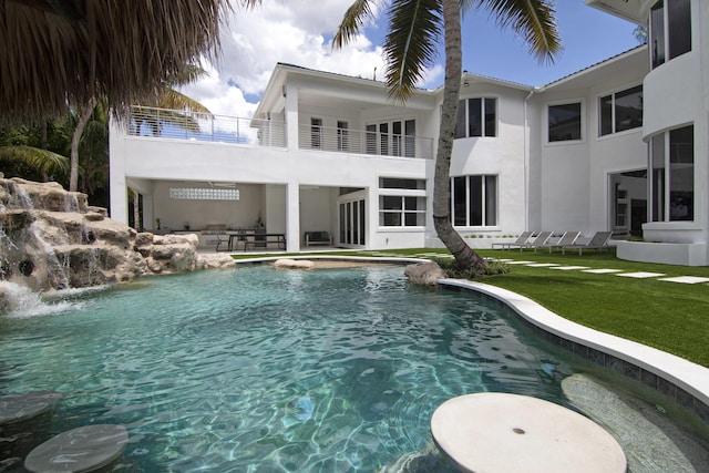 view of swimming pool with a lawn