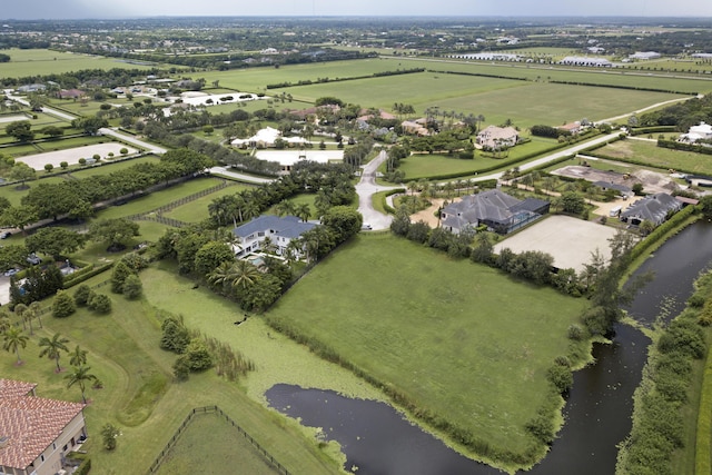 birds eye view of property with a water view and a rural view