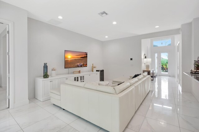 living room featuring light tile patterned flooring