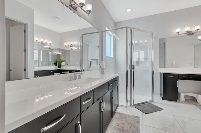 bathroom with tile patterned floors, walk in shower, and vanity