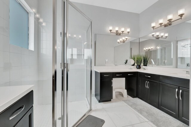 bathroom with vanity, tile patterned flooring, and an enclosed shower