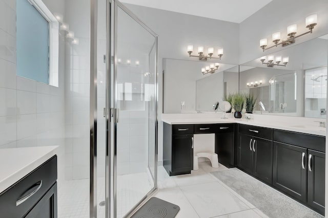 bathroom featuring vanity and a shower with door