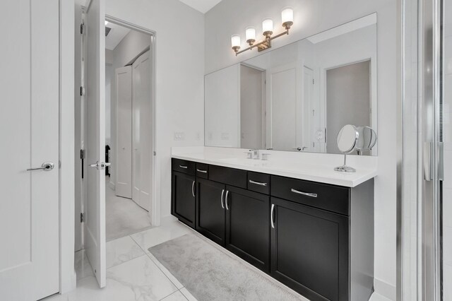 bathroom with vanity and tile patterned flooring