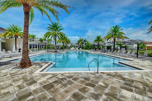 view of swimming pool featuring a patio area