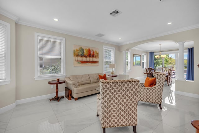 tiled living room with a wealth of natural light, ornate columns, and ornamental molding