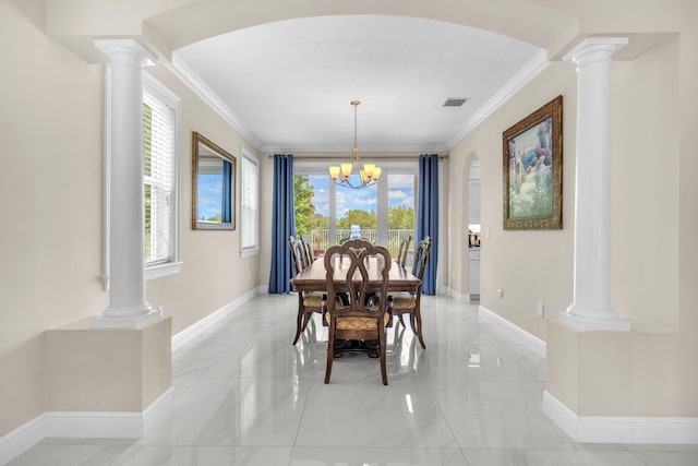 9229 Delemar Ct, Wellington, FL 33414 - dining space with ornate columns, a chandelier, ornamental molding, and baseboards