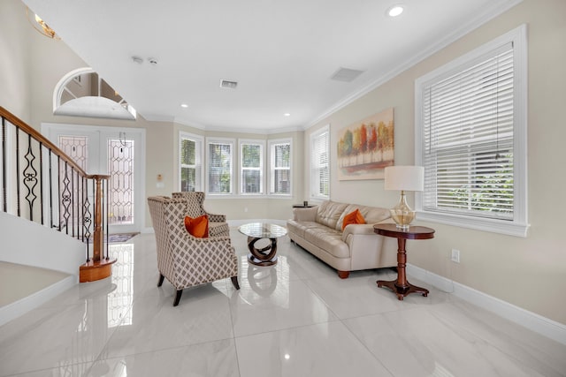 living room with light tile patterned flooring, a healthy amount of sunlight, and ornamental molding