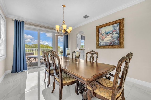 tiled dining area featuring crown molding and a chandelier