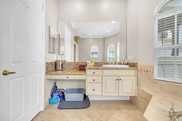 bathroom featuring crown molding, tile patterned floors, and vanity