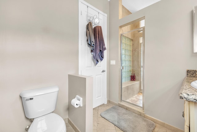 9229 Delemar Ct, Wellington, FL 33414 - bathroom featuring a stall shower, toilet, baseboards, and tile patterned floors
