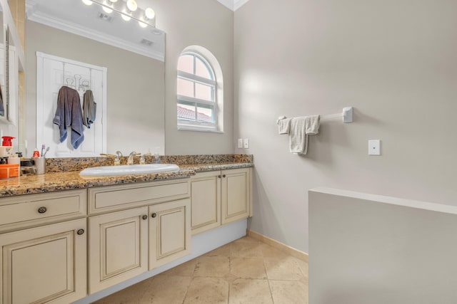 bathroom featuring tile patterned floors, ornamental molding, and vanity