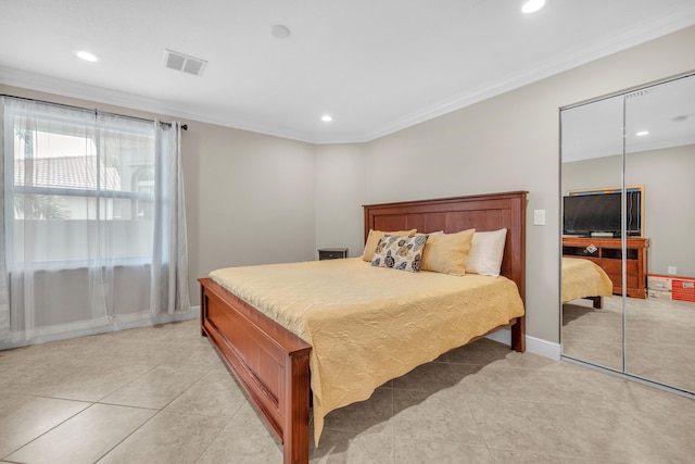 9229 Delemar Ct, Wellington, FL 33414 - bedroom featuring light tile patterned floors, recessed lighting, crown molding, a closet, and baseboards