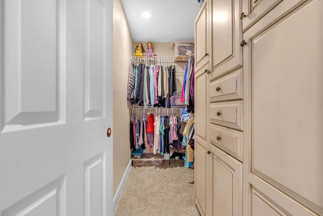 walk in closet featuring light tile patterned floors