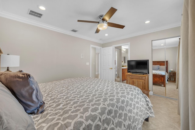 bedroom featuring a closet, ceiling fan, light tile patterned flooring, and ornamental molding