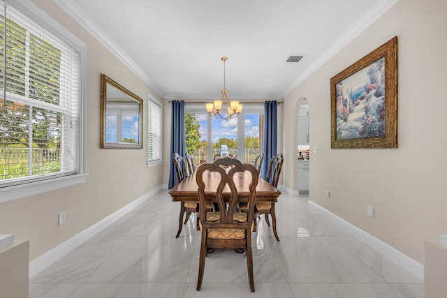 9229 Delemar Ct, Wellington, FL 33414 - dining room featuring a chandelier, light marble finish flooring, plenty of natural light, and ornamental molding
