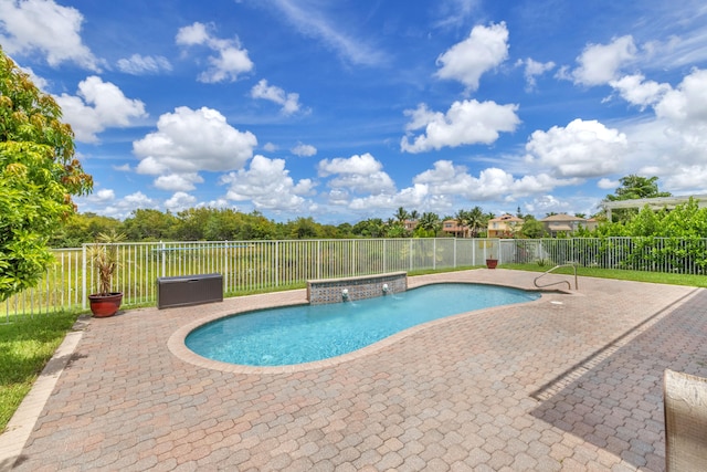 view of pool with a patio and pool water feature