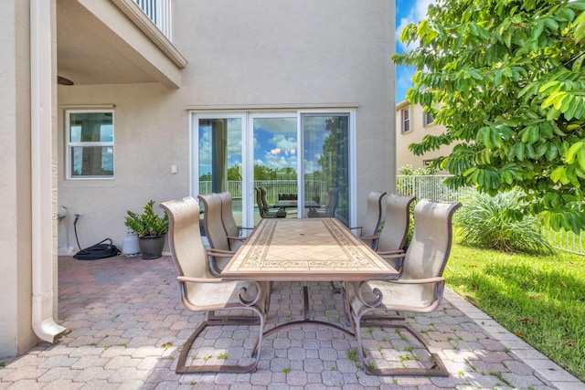 9229 Delemar Ct, Wellington, FL 33414 - view of patio / terrace featuring outdoor dining area and fence