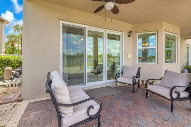 view of patio featuring ceiling fan