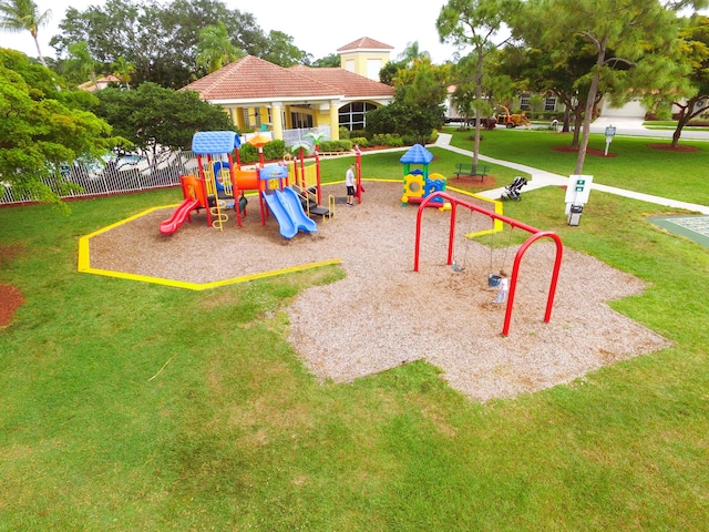 communal playground featuring fence