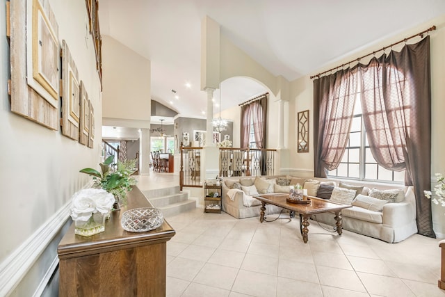 tiled living room with high vaulted ceiling