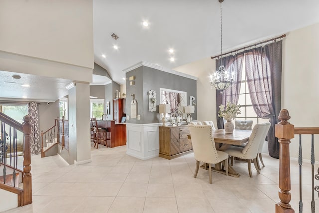 dining area featuring high vaulted ceiling, an inviting chandelier, and light tile patterned floors