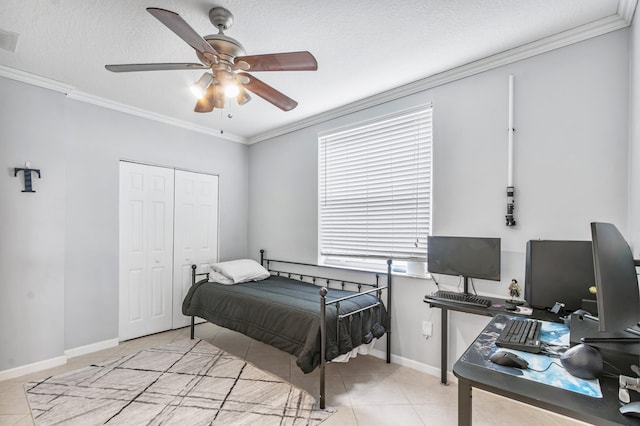 bedroom featuring ceiling fan, a closet, light tile patterned flooring, and ornamental molding