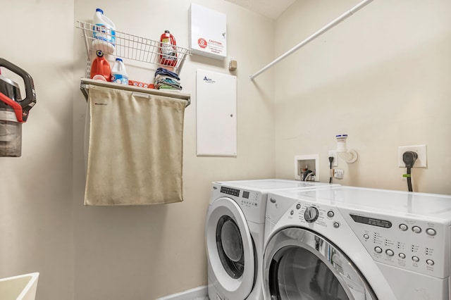 washroom featuring washing machine and dryer