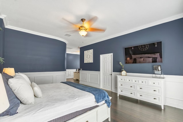 bedroom featuring ceiling fan, dark wood-type flooring, and ornamental molding