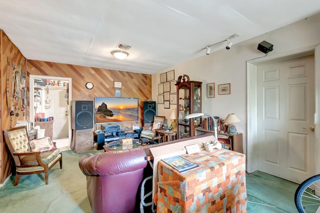 living room featuring light colored carpet and wooden walls