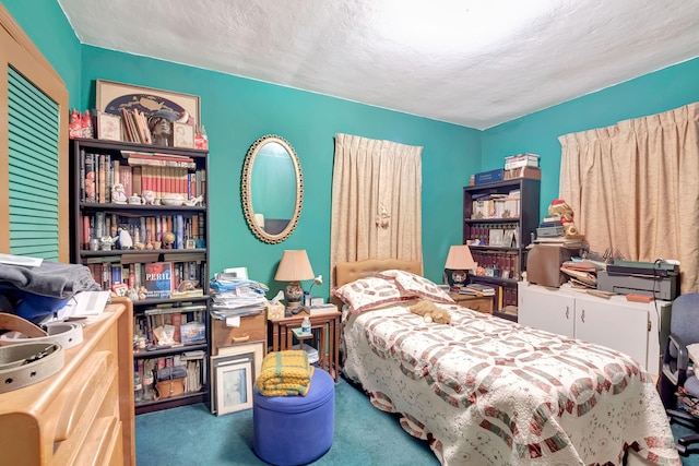 bedroom with carpet flooring and a textured ceiling