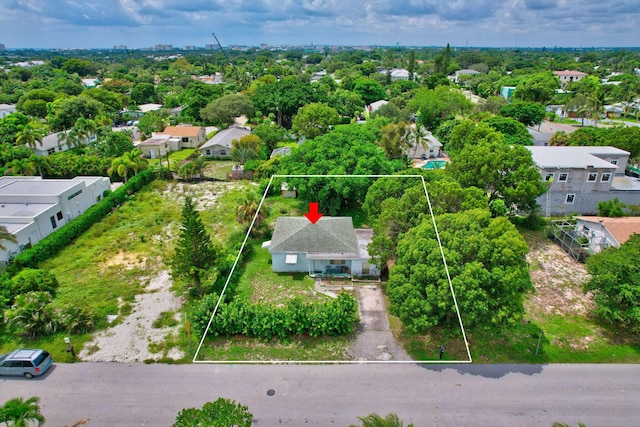 birds eye view of property with a residential view