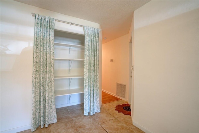 interior space featuring a textured ceiling