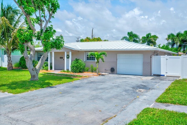 ranch-style house with a garage and a front yard