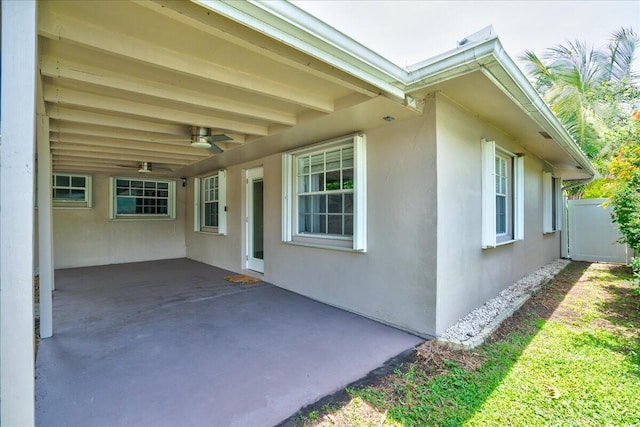 view of home's exterior with a patio and ceiling fan