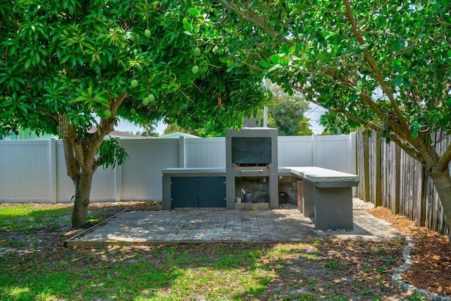 view of patio featuring a fireplace