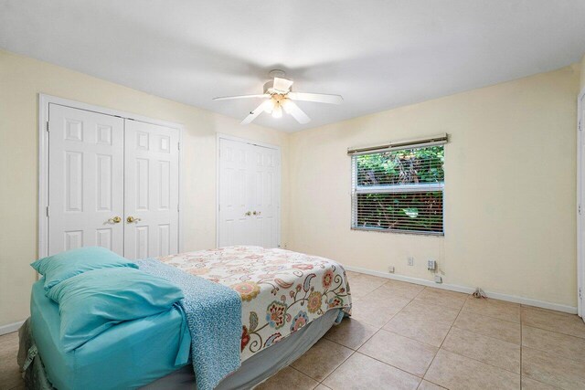 bathroom with tile patterned flooring, a shower with shower door, and sink