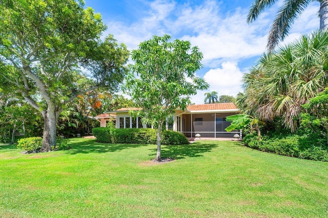 view of yard featuring a sunroom