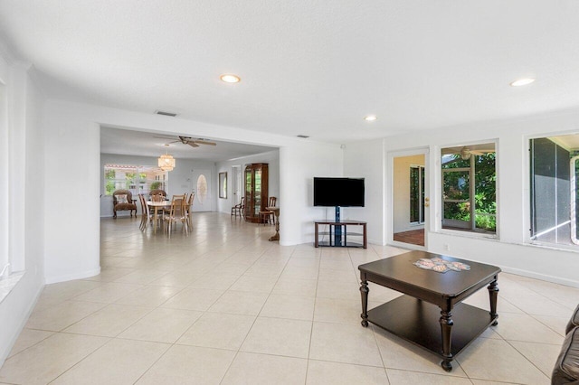 kitchen with sink, ceiling fan, light tile patterned floors, tasteful backsplash, and stainless steel appliances