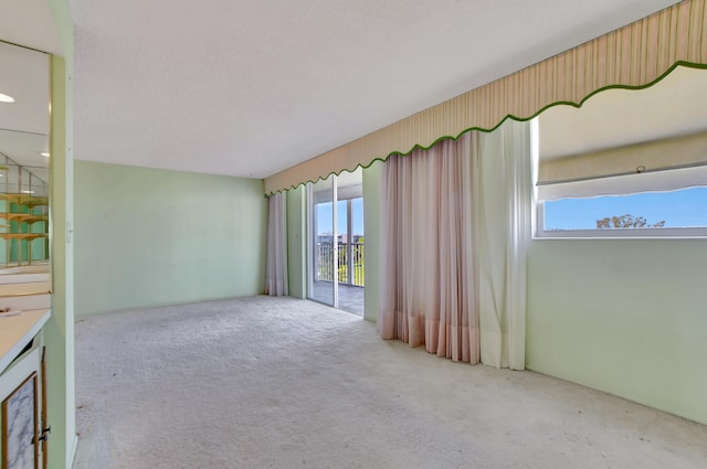 empty room featuring light colored carpet