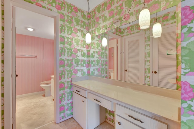 bathroom with tile patterned flooring, toilet, and vanity