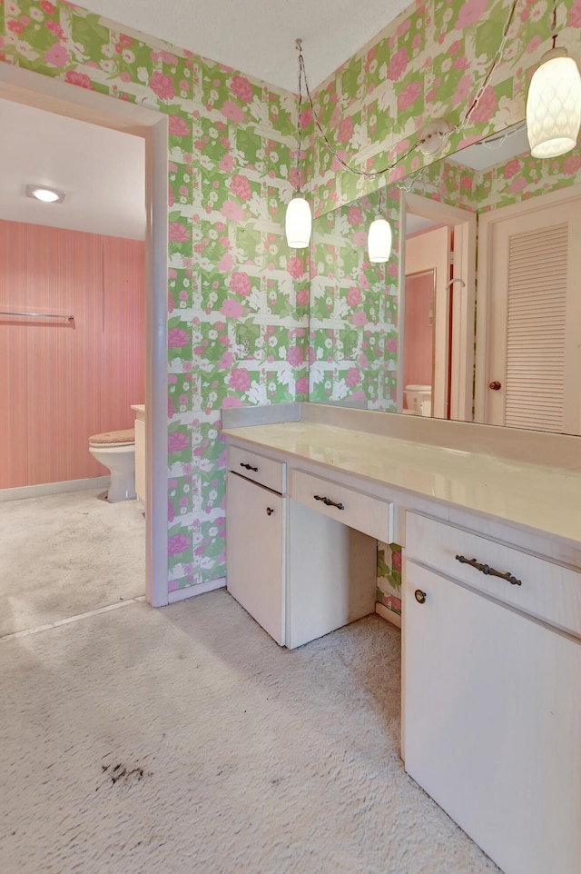 bathroom featuring vanity and toilet