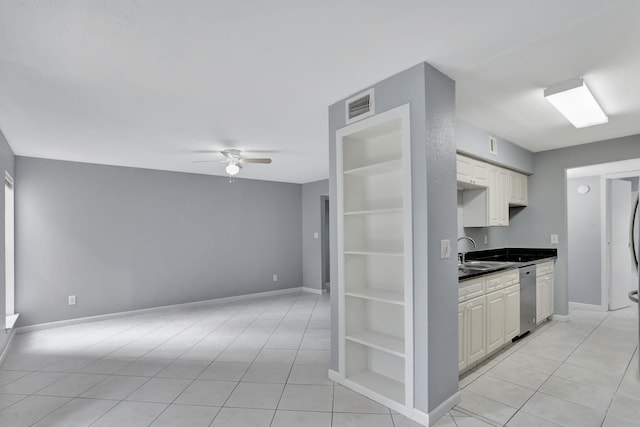 kitchen featuring stainless steel dishwasher, light tile patterned flooring, sink, and ceiling fan