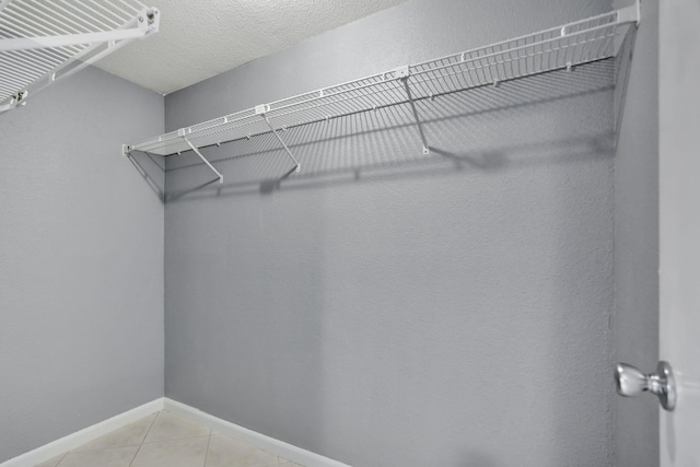 walk in closet featuring tile patterned floors